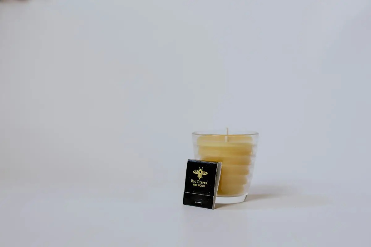 Natural beeswax candle on a plain background